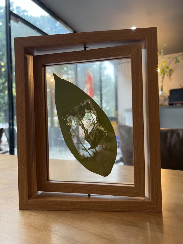 Picture on leaf with family as office decor.