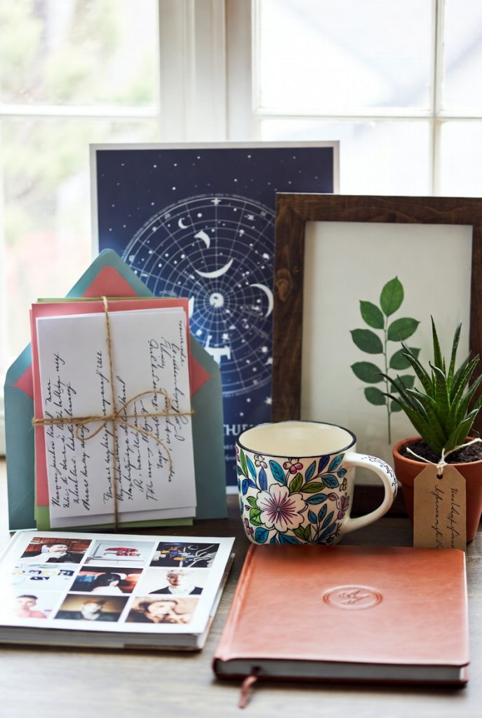 Thoughtful affordable birthday setup with handwritten letters, custom star map and preserved leaf portrait, perfect meaningful birthday gifts for loved ones.