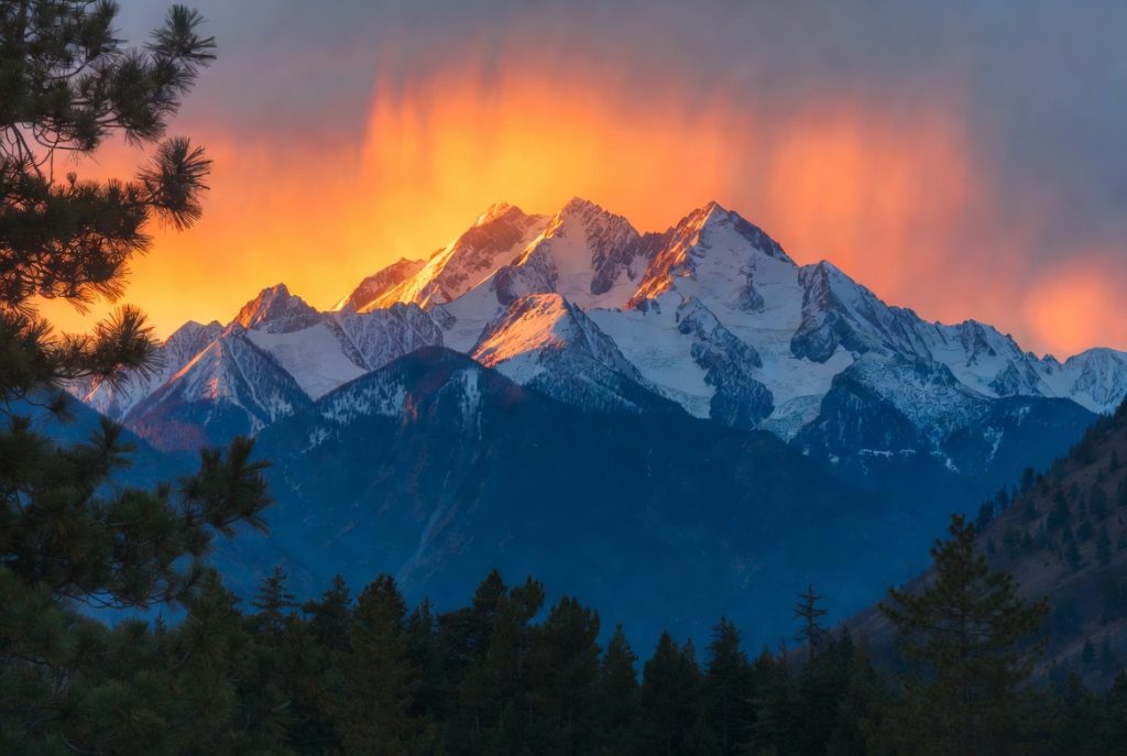 Custom personalized nature art print for him featuring a dramatic snow-capped mountain ridge at golden hour on premium canvas